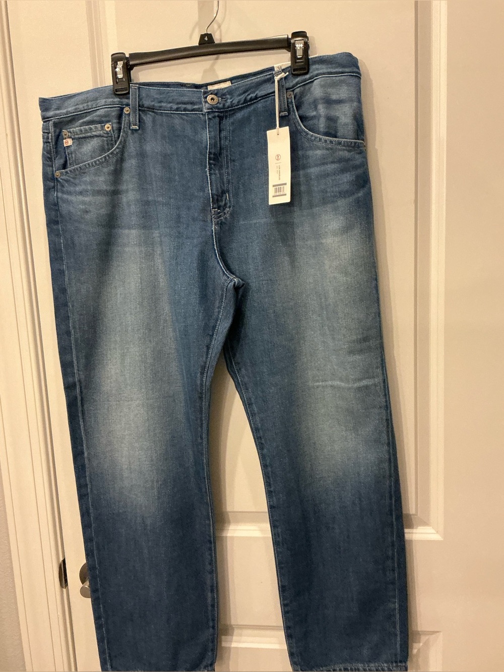 WOMANS  Mid Wash Blue Jeans. AG all jeans weekend  46 dollars